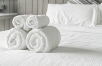 White towel on bed decoration in bedroom interior